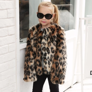 Detailed close-up of girls leopard faux fur coat texture with thick warm plush material