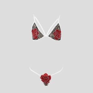 Detail view of floral red rose embroidery on black lace lingerie set with white straps