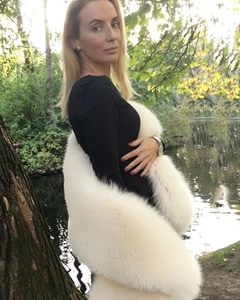 Detailed view of the plush white faux fur shawl textured like soft fox or rabbit fur
