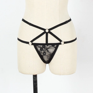 Detailed close-up of sexy black lace thong featuring three silver metal O-rings