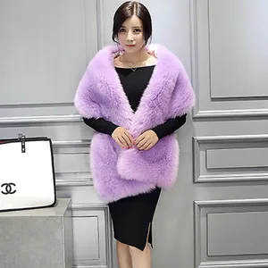 Detailed view of light purple faux fur shawl with plush texture worn over a black dress
