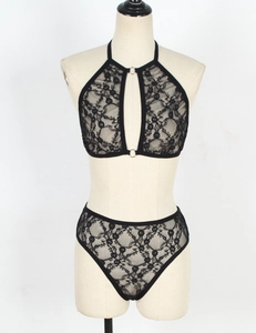 Detail of black floral lace lingerie set with silver ring accents on high-waist panty and bra