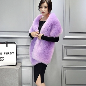 Detailed texture of purple faux fox fur vest shawl styled over a long black dress