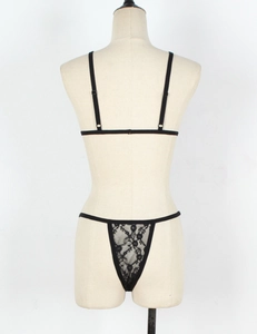Back view of black floral lace lingerie set with elastic straps on a mannequin