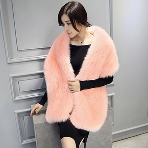 Close-up of soft pink faux fur texture and fluffy pile on an elegant evening shawl
