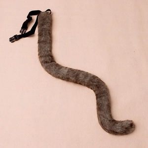 Detail view of the brown grey faux fur cat tail with adjustable black nylon waist strap