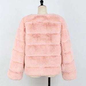 Detail view of pink faux fur jacket showing the horizontal seam texture and soft plush fabric