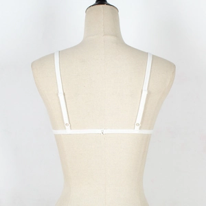 Detail view of the white lace bra back with adjustable thin straps and minimalist buckle closure