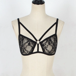 Detail of black floral lace bra with thin straps and metallic ring center detail