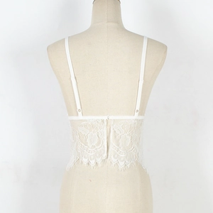 Close-up of white floral lace bralette back detail with adjustable straps and hook closure