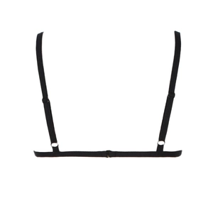 Detail of adjustable thin black lace straps and hardware on the minimalist back structure