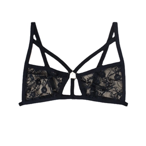 Sexy black lace cutout bralette with harness straps and silver ring detail on white background