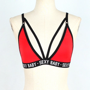 Detail of red and black bra featuring sexy baby letter print and cross-strap design