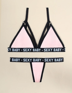 Pink two-piece lingerie set with SEXY BABY elastic logo bands and black trim detail