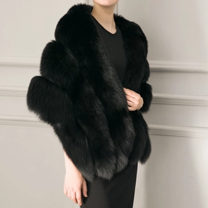 Detailed view of the thick black faux fur shawl showing premium texture and fibers