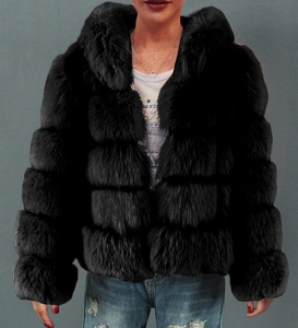 Macro detail of black faux fur jacket showing high-density horizontal plush segments