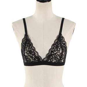 Sexy black floral lace triangle bra with thin straps and elastic band on mannequin