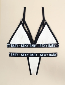 Close-up of contrast lingerie set featuring SEXY BABY letter print elastic bands