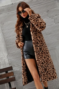 Long faux fur leopard coat styled with gold chain necklace and black sunglasses