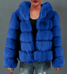 Close-up of royal blue faux fur hooded jacket with horizontal layered design and plush texture