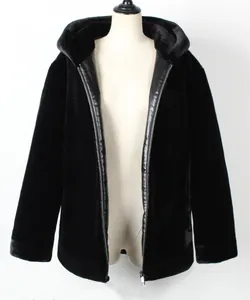 Detail of black faux fur hooded jacket with zipper closure and smooth leather trim