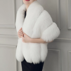 Detailed close-up of premium white faux fur bridal shawl with long fox fur texture