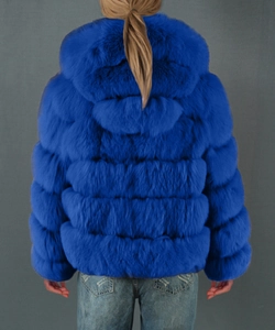 Back view of Klein blue faux fur hooded jacket showing thick horizontal segment texture