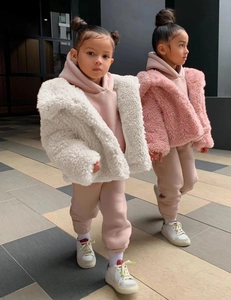 Detailed view of children's plush faux fur jacket with warm hoodie and jogger set