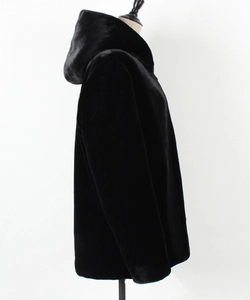 Detailed side view of black faux fur hooded jacket with premium plush texture