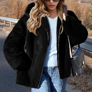 Women's black hooded faux fur jacket with metal zipper in a loose casual autumn fit