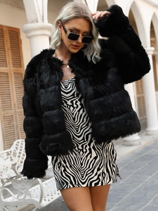 Detail view of premium faux fur texture and horizontal stripes on black cropped jacket