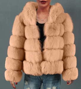 Detail view of pink faux fur hooded jacket with layered texture and soft plush material