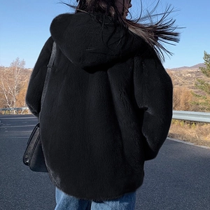 Women's black hooded faux fur jacket with relaxed fit and soft thick plush texture