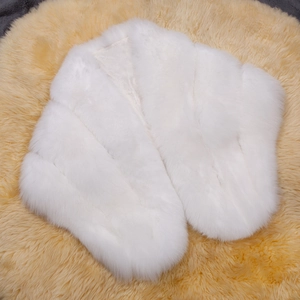 Luxurious white faux fur shawl for bridal or party wear on a soft plush background