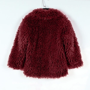 Detail view of the back of thick deep red long-pile faux fur winter coat for children