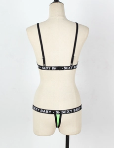 Detail view of neon green lingerie set with white sexy baby printed elastic bands