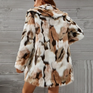 Detail view showing multi-color faux fur texture on a long sleeve shawl collar coat