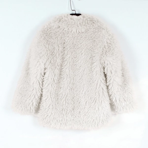 Close-up of white faux fur texture on the back of a cozy kids winter plush coat