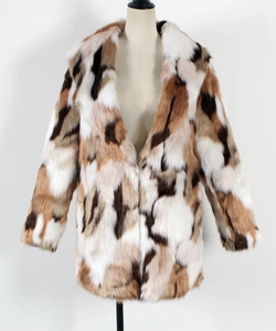 Detail view of multicolored faux fur coat featuring lapel collar and soft fluffy texture