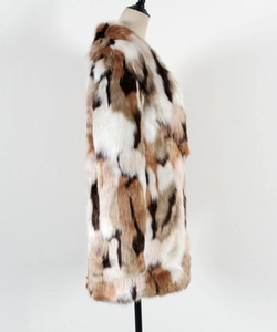 Detailed side view of faux fur coat with white brown and black patchwork design