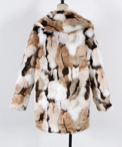 Detailed back view of a plush faux fur coat with irregular brown and white spots