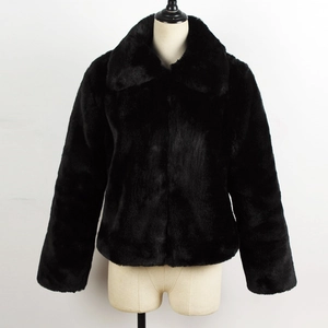 Detail of a black faux fur jacket showing high-quality fluffy texture and lapel design