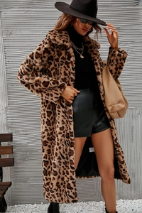Close-up of leopard print faux fur coat material with wide lapel and soft texture