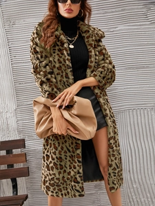 Detailed texture of leopard print faux fur coat with soft fluffy material and large collar