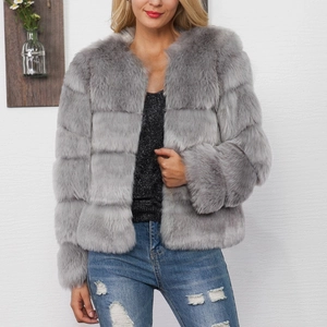 Detail of grey faux fur coat featuring a textured horizontal stripe design for women