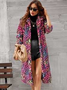 Detail of colorful leopard print faux fur coat with vibrant pink and blue plush texture