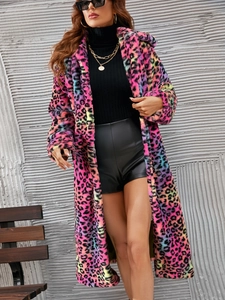 Close-up of colorful leopard print faux fur coat with plush texture and vibrant hues
