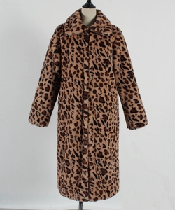 Detailed view of women's leopard print faux fur coat with thick plush texture and wide lapels