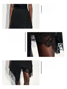 Detail of high waist, satin fabric, and irregular hem with eyelash lace on black skirt