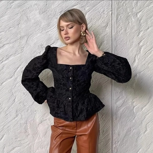 French jacquard black blouse with puff sleeves, square neckline and elegant ruffle hem